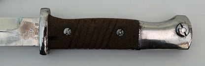 Baïonnette S84/98 III 1944 | Karabiner 98k – Wehrmacht98k – 1944.
Zoom sur poignée face B